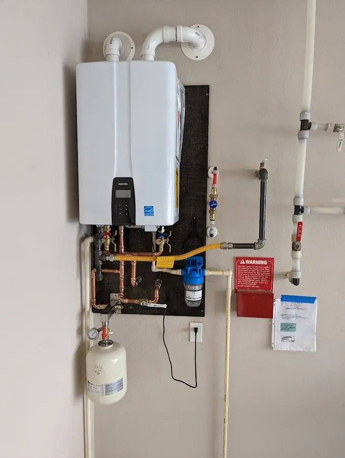 Professional plumber installing copper piping in a La Habra Heights home